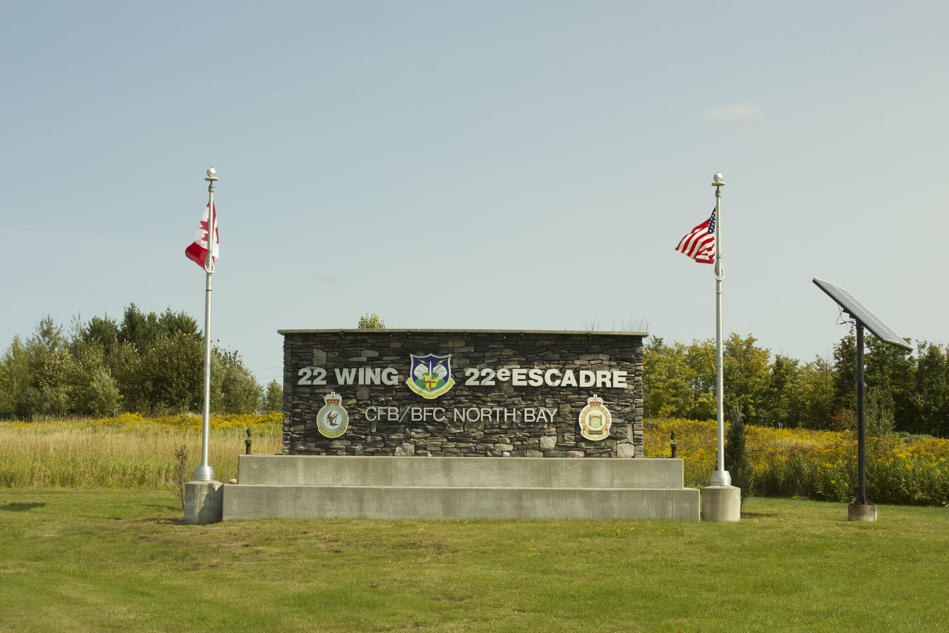 22 Wing and 22e Escadre monument at CFB North Bay with Canadian and American flags