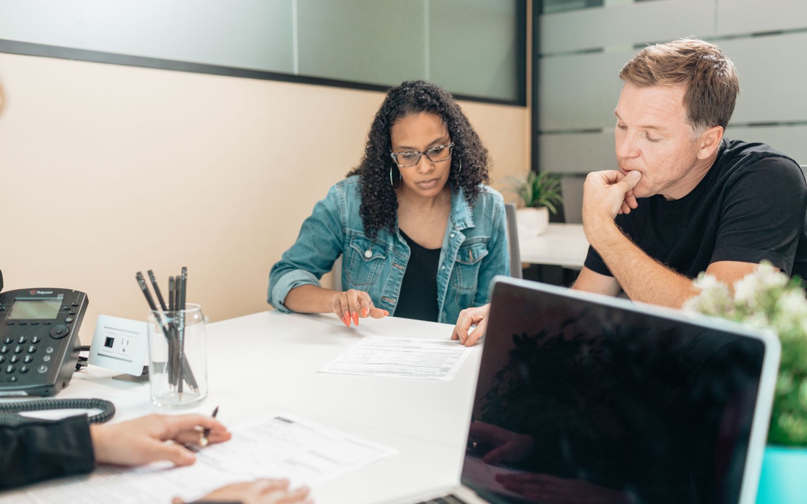 Homeowners reviewing financial paperwork at a table