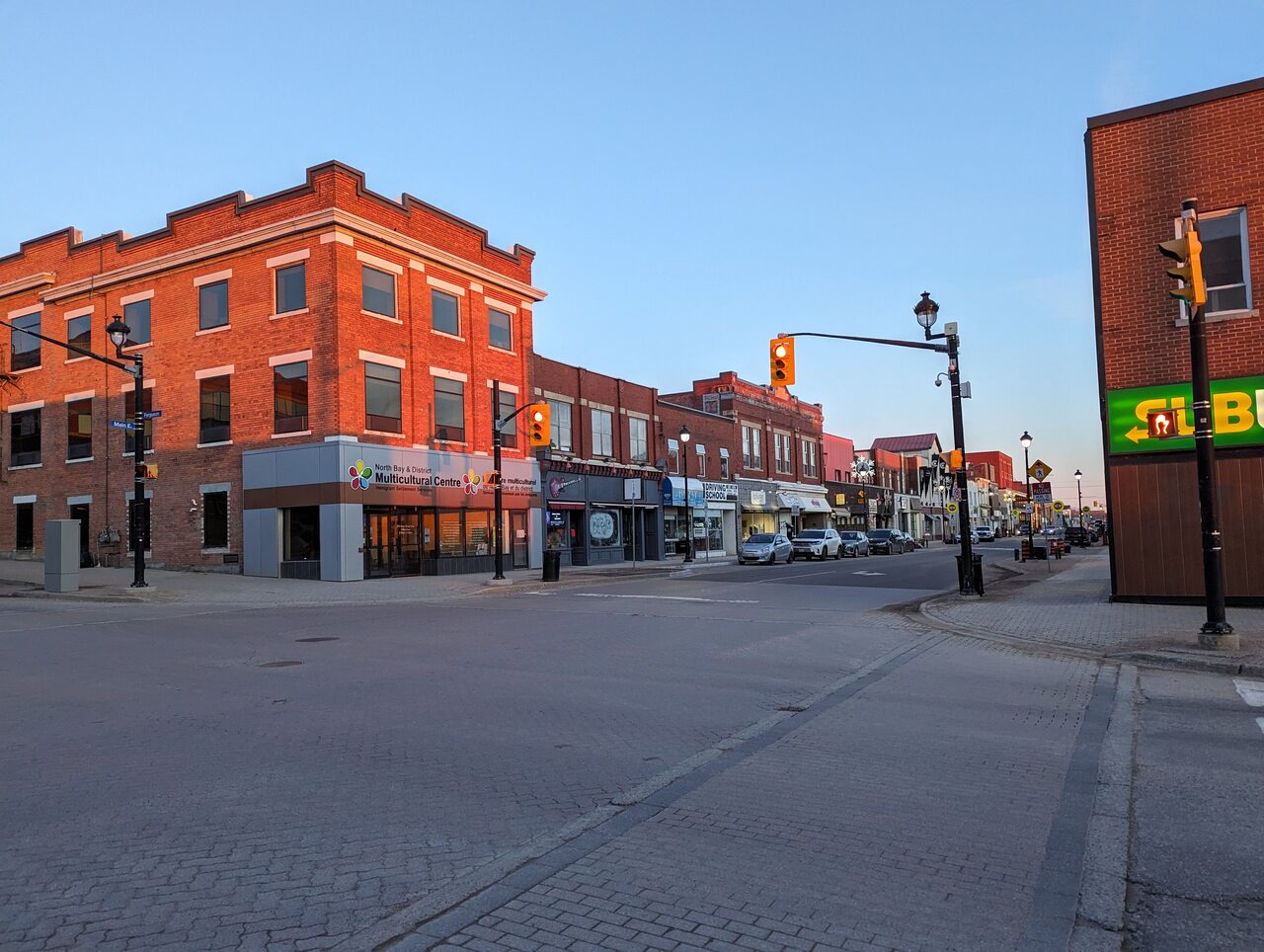 Brick storefronts at Ferguson Street and Main Street West in downtown North Bay.