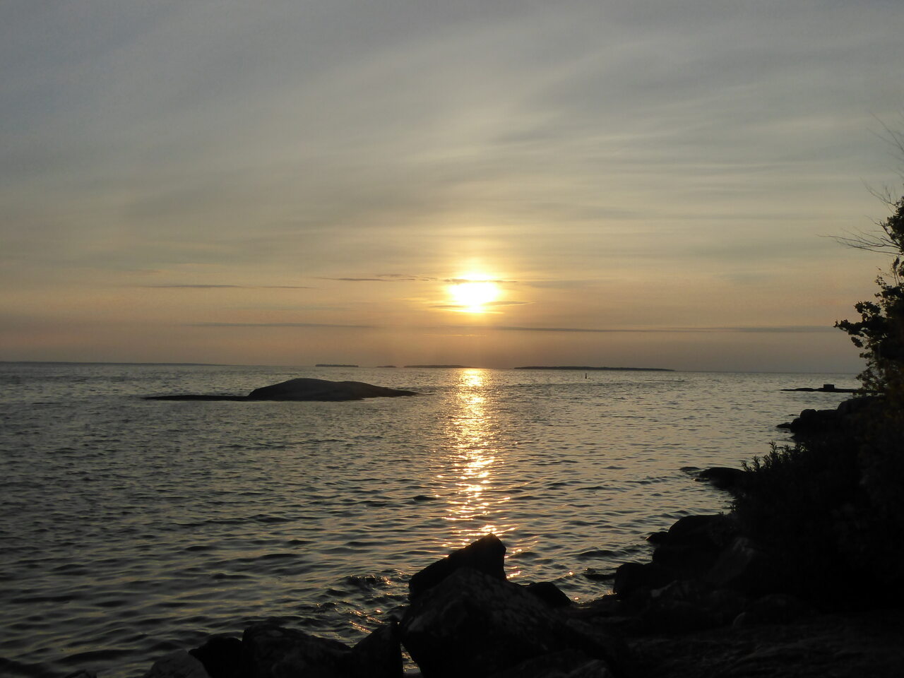Sun setting across Lake Nipissing and the Manitou Islands from Sunset Park.