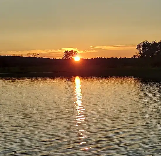 Sunset reflected across a lake