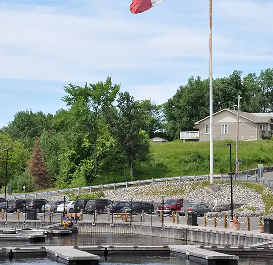 Boats moored beside a marina and waterfront homes